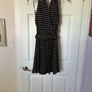 Black with pale tan Polk a dots swinging skirt sleeveless sexy dress. Size 6.